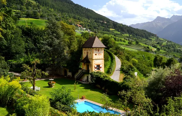 The sky, trees, flowers, mountains, house, tower, pool, yard