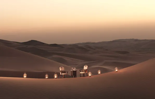 Picture romance, dunes, candles, a table for two, desert, wine, sand