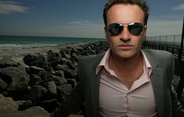 Sea, stones, Julian McMahon