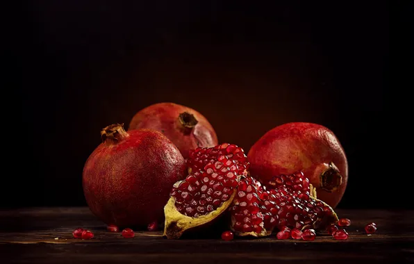 The dark background, grenades, pomegranate grains