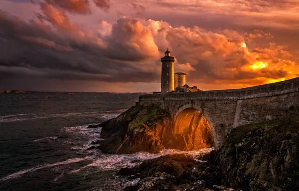 Sea, rocks, lighthouse