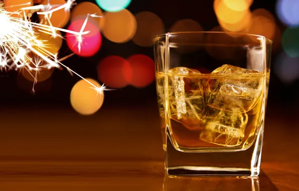 Ice, cubes, glass, sparks, whiskey, bokeh