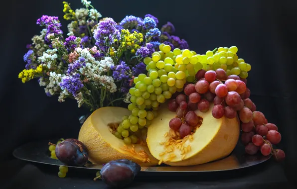 Picture grapes, plum, melon