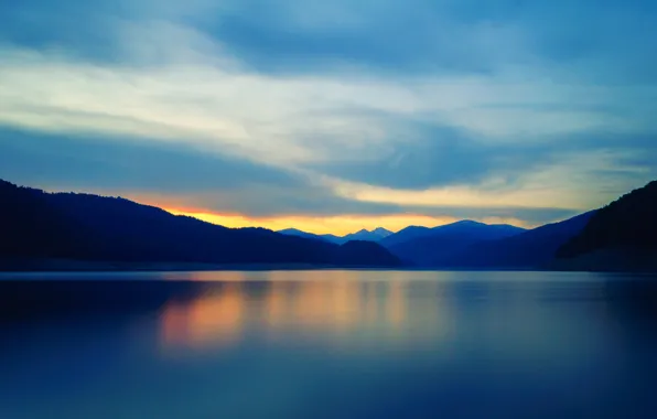 The sky, clouds, sunset, mountains, lake, reflection, mirror