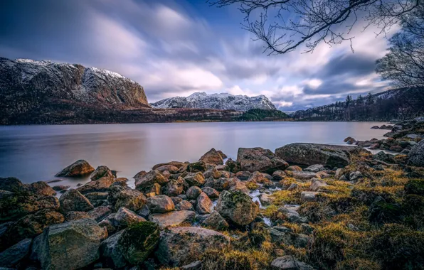The sky, clouds, mountains, lake, stones