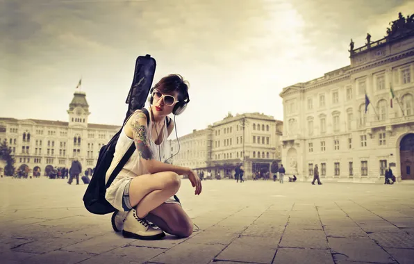 Girl, the city, guitar, headphones, glasses, case