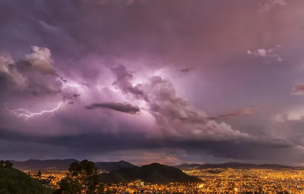 The storm, mountains, clouds, the city, lightning, the evening