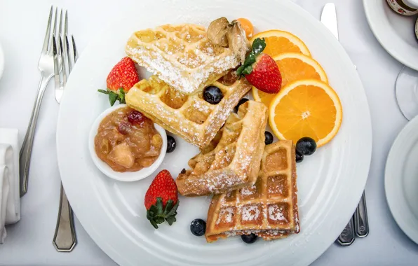 Oranges, strawberry, waffles