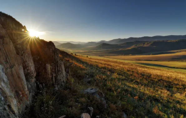 Picture field, autumn, the sky, the sun, rays, light, mountains, stones