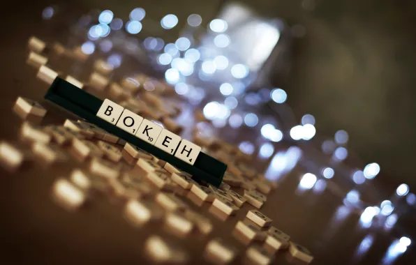 Light, letters, cubes, the game, figures, on the table, bokeh, randomly