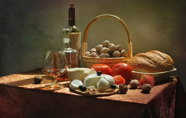 Wine, cheese, bread, nuts, tomato, olives
