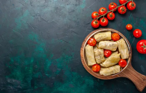 Tomatoes, cutting Board, cabbage rolls
