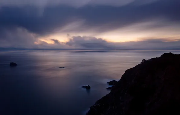 Sea, the sky, rocks, the evening