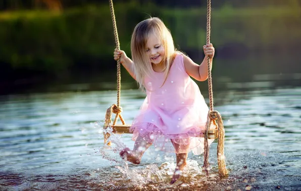 Picture girl, lake, swing, squirt