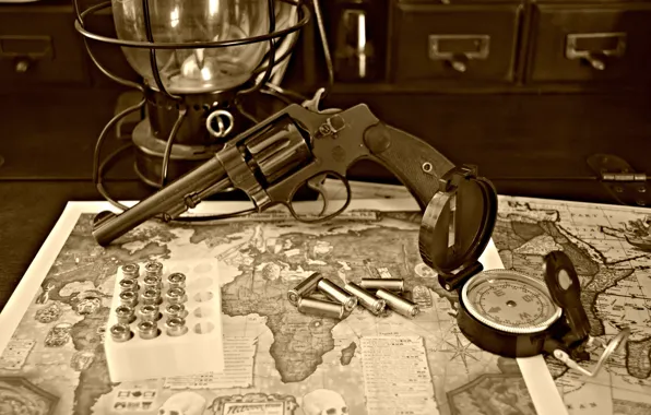 Picture map, trunk, bullets, revolver, compass