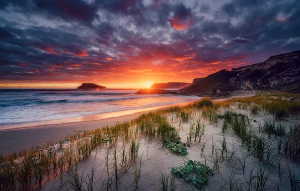 Sand, sea, grass, clouds, sunset, mountains, rocks, shore