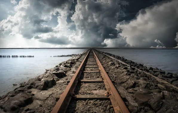 Sea, clouds, railroad