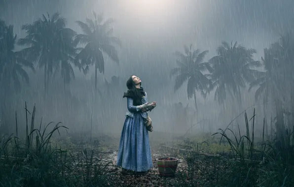 Girl, palm trees, rain