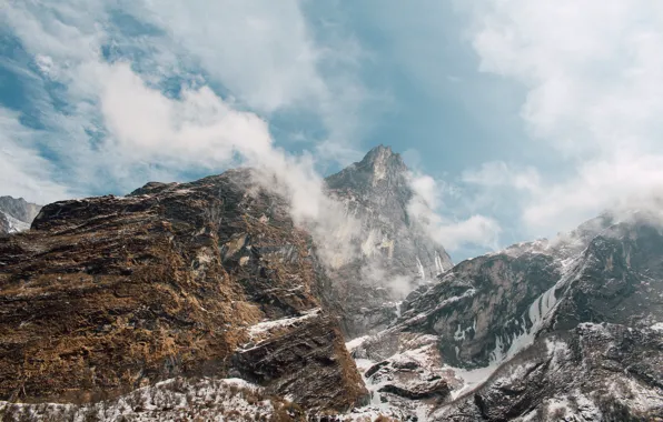 Picture the sky, mountains, rocks, top