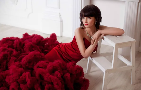 Brunette, red dress, stool, sitting on the floor
