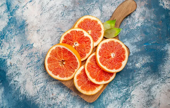 Blue background, slices, grapefruit