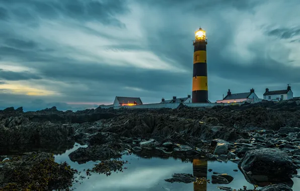 The sky, water, clouds, lights, stones, lighthouse, the evening, house
