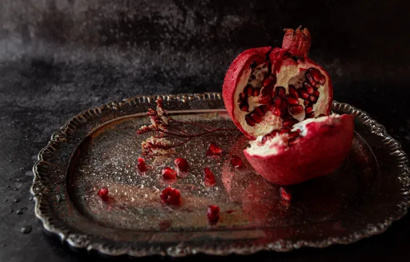 The dark background, tray, garnet, half, in half, cut, pomegranate grains