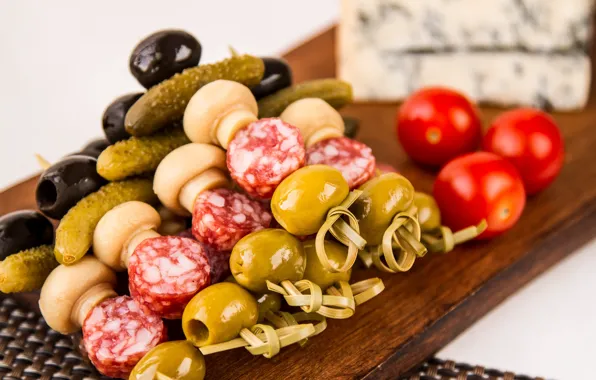 Mushrooms, tomatoes, olives, sausage, cucumbers, olives, appetizer