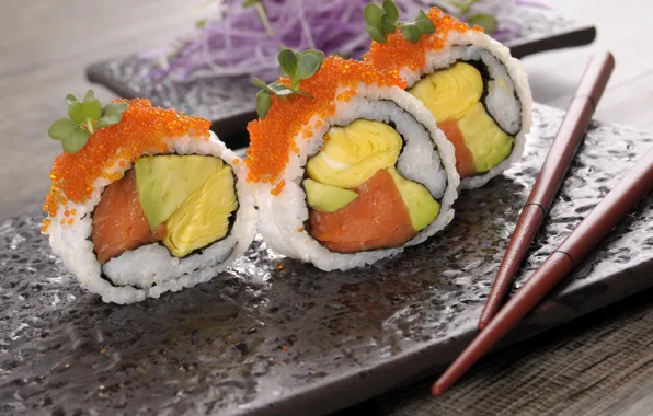 Sticks, caviar, sushi, avocado, salmon, omelette