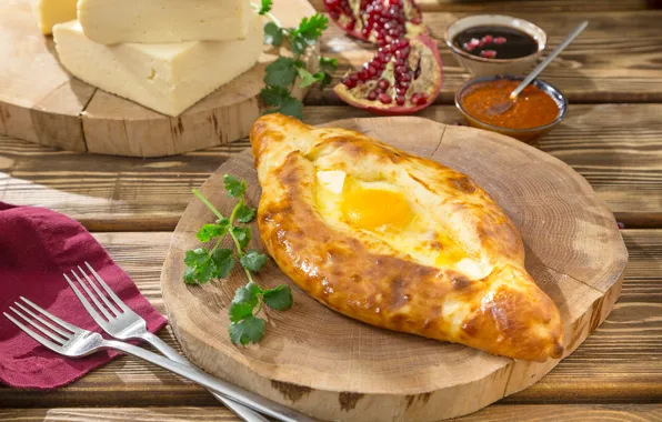 Picture greens, eggs, cheese, sauce, khachapuri