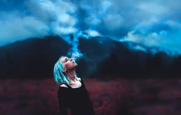 Picture girl, landscape, fading storm, blue smoke