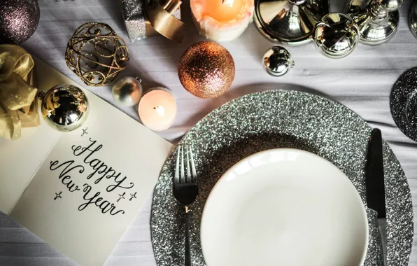 Picture the inscription, new year, candle, sequins, plate, knife, plug