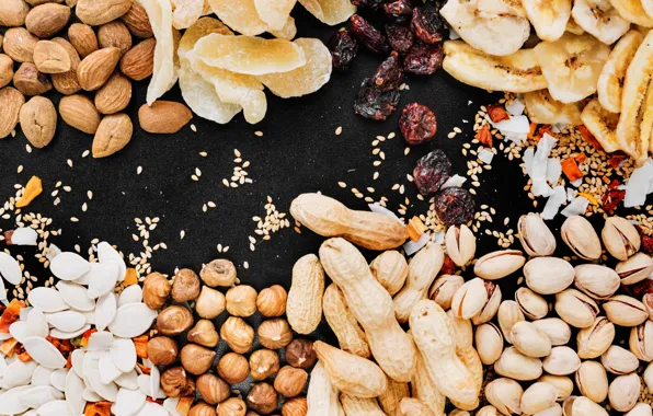 Black background, nuts, banana, almonds, hazelnuts, peanuts, pistachios, candied