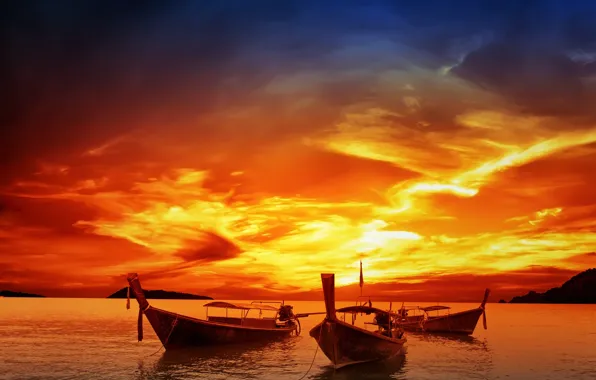 The sky, water, sunset, boats