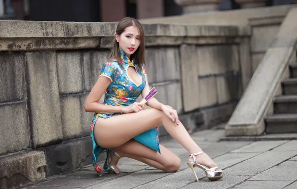 Sexy, Asian, beautiful girl, on the heels, national costume, slender legs, the neckline on the …