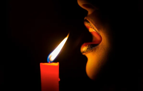 Darkness, fire, candle, breath, lips