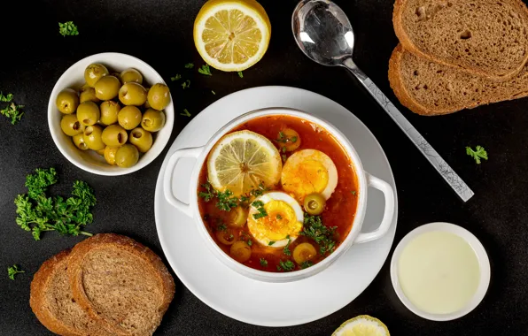 Egg, bread, soup, olives