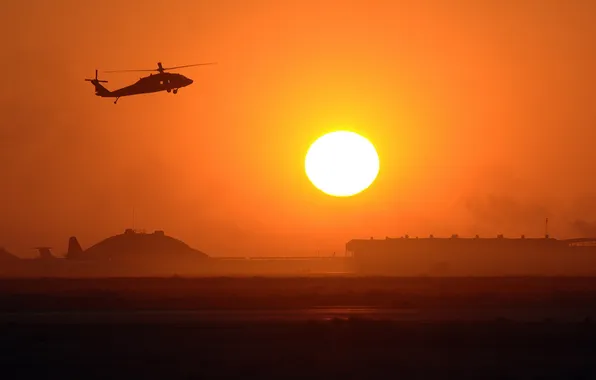 Picture the sun, sunset, helicopter, structure, black hawk, black howk