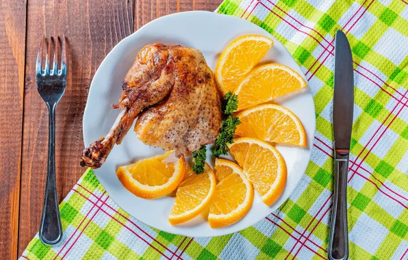 Picture orange, chicken, plate, knife, plug, napkin, meal