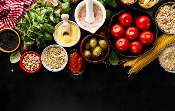 Black background, tomatoes, olives, tomatoes, salt, pasta, oatmeal, chickpeas