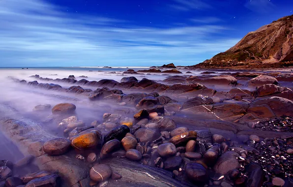 Sea, the sky, stones, rocks, the evening
