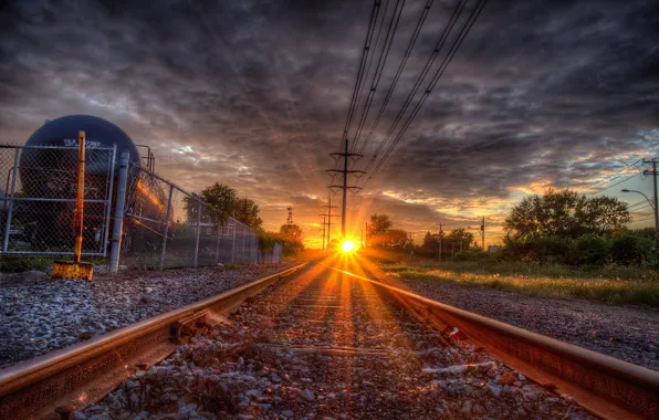 Picture the way, rails, sleepers, the sun