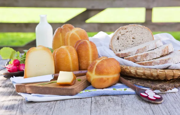 Greens, table, basket, cheese, milk, bread, knife, napkin