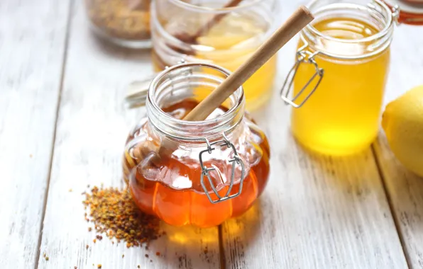 Lemon, honey, jars, spoon