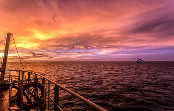 Sea, sunset, ships