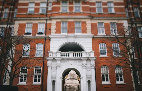 Picture the building, jacket, hood, fur