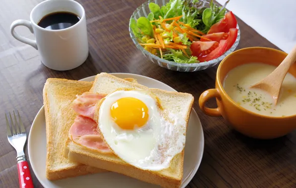 Coffee, scrambled eggs, bacon, salad, toast