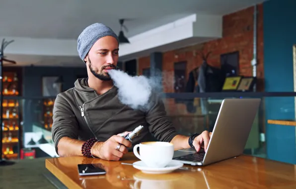 Picture smoke, notebook, man, wool hat, cell phone, electronic cigarette
