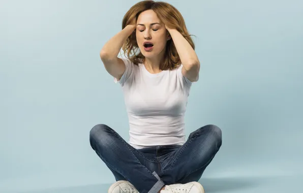Girl, jeans, t-shirt, brown hair, sitting