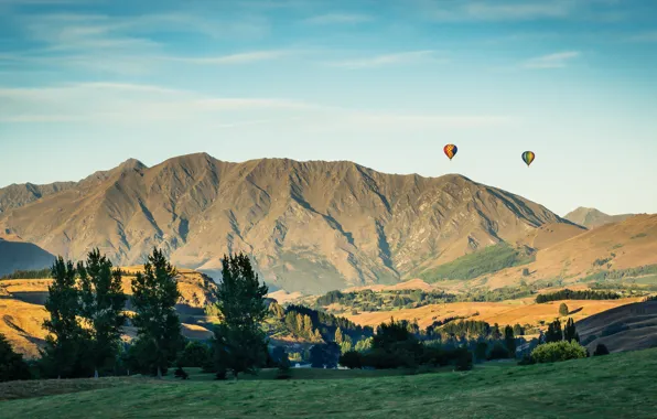 Trees, hills, trees, hills, ballons, cylinders